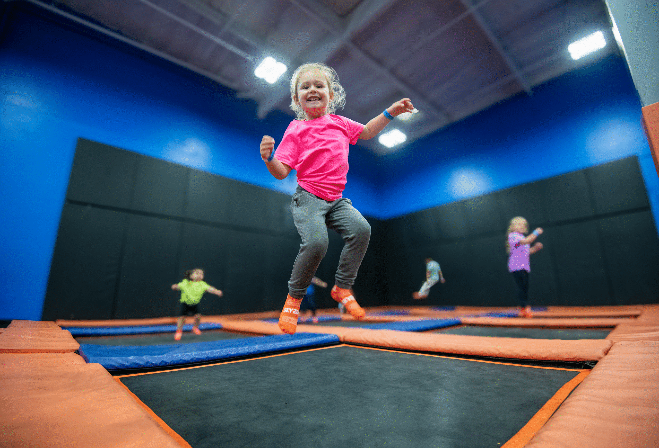 Toddler jumping on a trampoline at Sky Zone